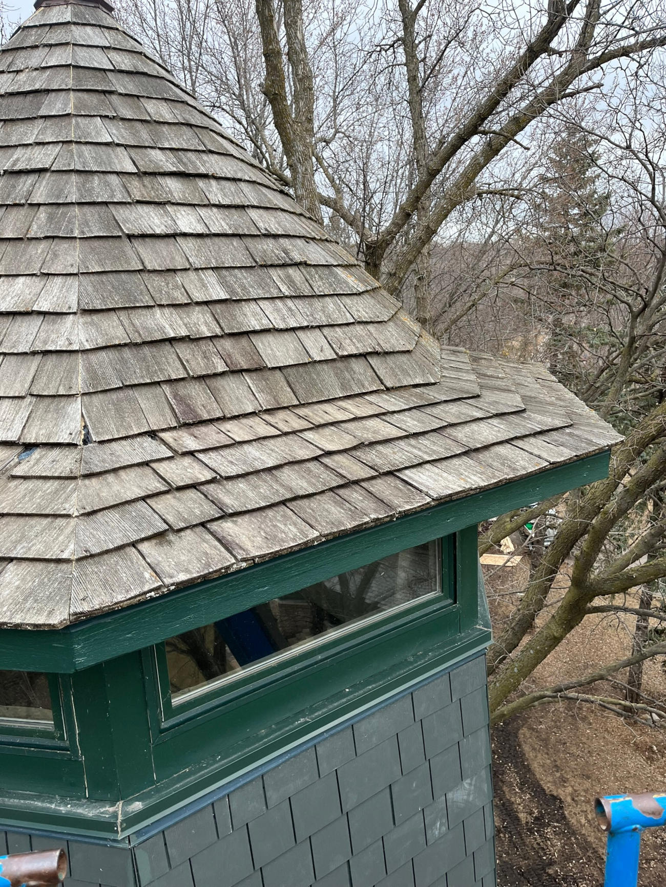 Wood shingle roof on turret-style structure built by Minnesota Structures