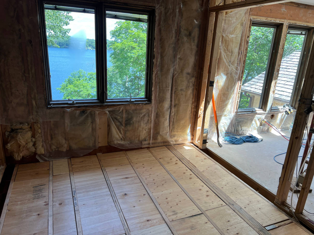 Interior remodel with new subfloor installation and lake view windows