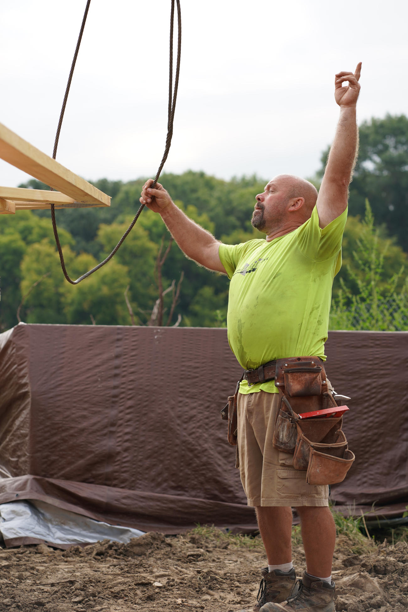Minnesota Structures builder raising beam during residential framing work